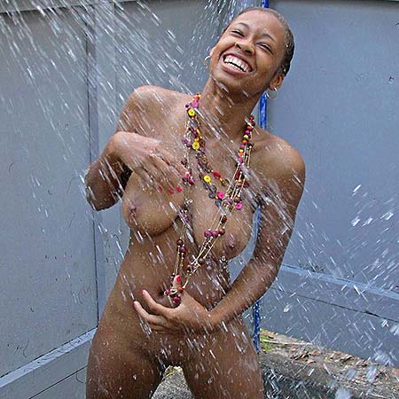 Busty Tierra Watson takes a backyard shower